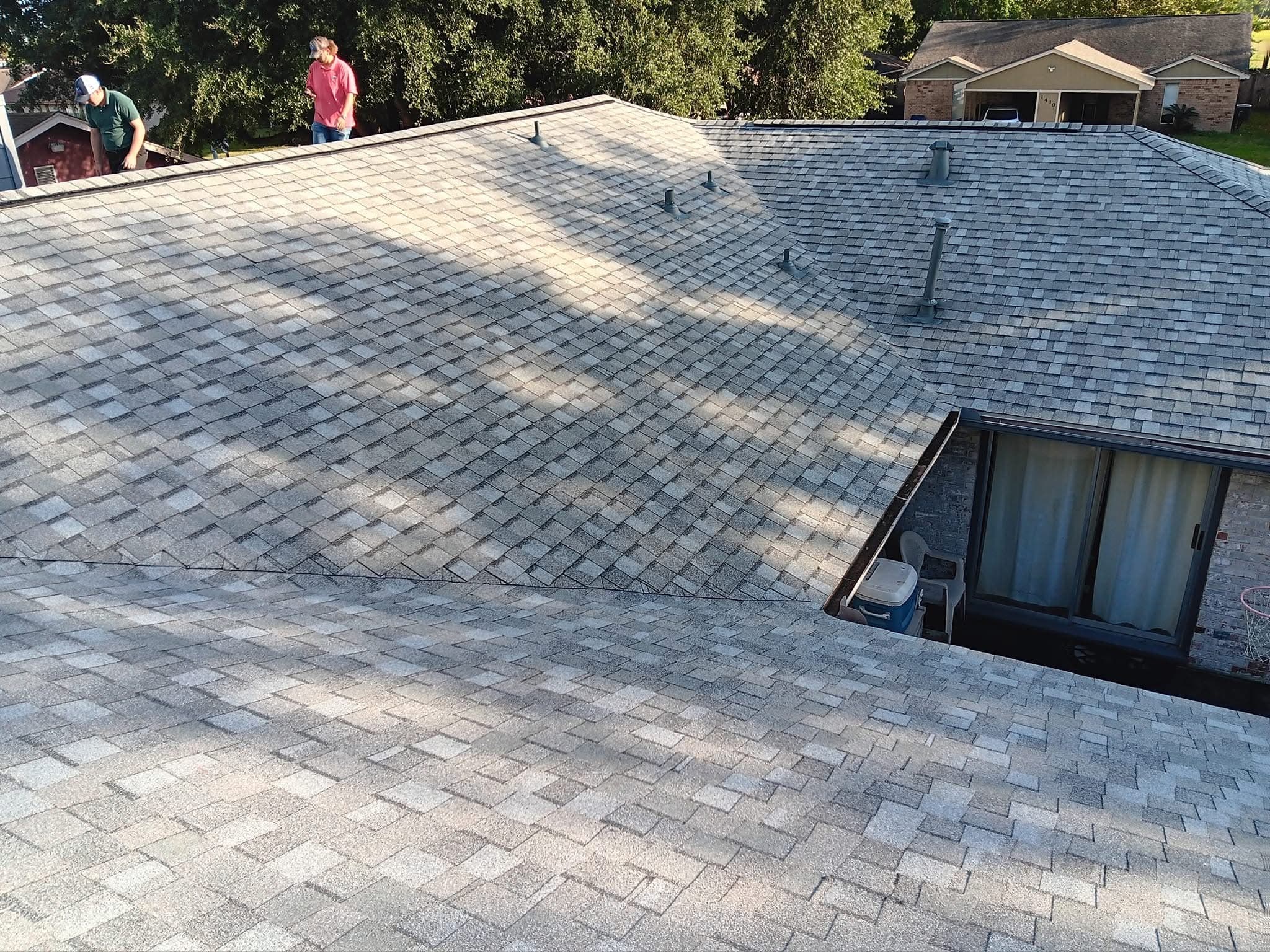 Texas Hurricane Roofing crew completing a new shingle roof installation