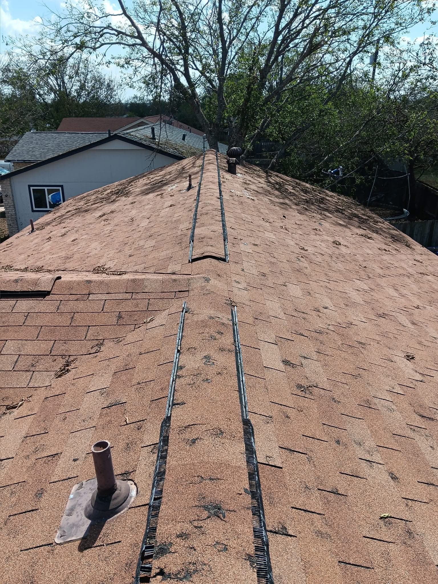 Weathered, storm-worn roof documented before replacement